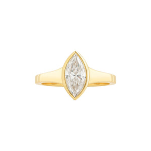Signet style yellow gold engagement ring set with a marquise cut lab grown moissanite. Tapered shoulders.