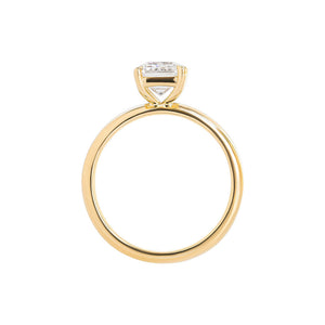 Yellow gold solitaire engagement ring with a wide, chunky tapered band in yellow gold. Gallery view.