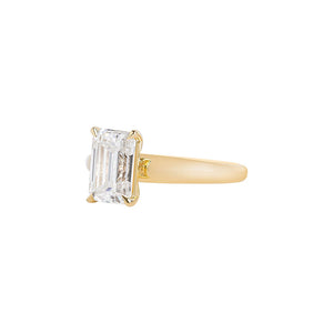 Yellow gold solitaire engagement ring with a wide, chunky tapered band in yellow gold.