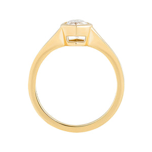 Signet style yellow gold engagement ring set with a marquise cut lab grown moissanite. Tapered shoulders.