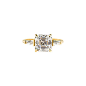 Elegant, art-deco inspired Asscher cut engagement ring with tapered baguettes. Cathedral setting.