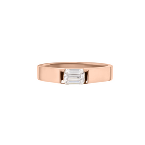 Rose gold emerald cut moissanite or lab-grown diamond signet ring. A sleek, signet-inspire balance between a traditional engagement ring and wedding band.