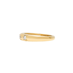 Yellow gold domed band featuring three shimmering bead-set lab diamonds inside of star settings. Side view.