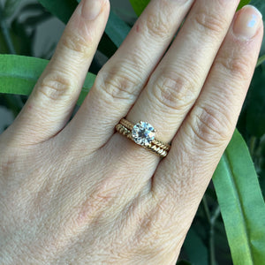Yellow gold Old European Cut cathedral engagement ring, with hand wheat engraving inspired by the Art Deco period. Stacked on hand with Twist band.