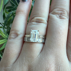 White gold emerald cut engagement ring, with hand wheat engraving inspired by the Art Deco period. Stacked on hand with Athens band.