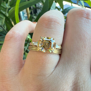 Our Grace Asscher Champagne Moissanite Engagement Ring Stacked with our Finn Band (Slim) in yellow gold. 