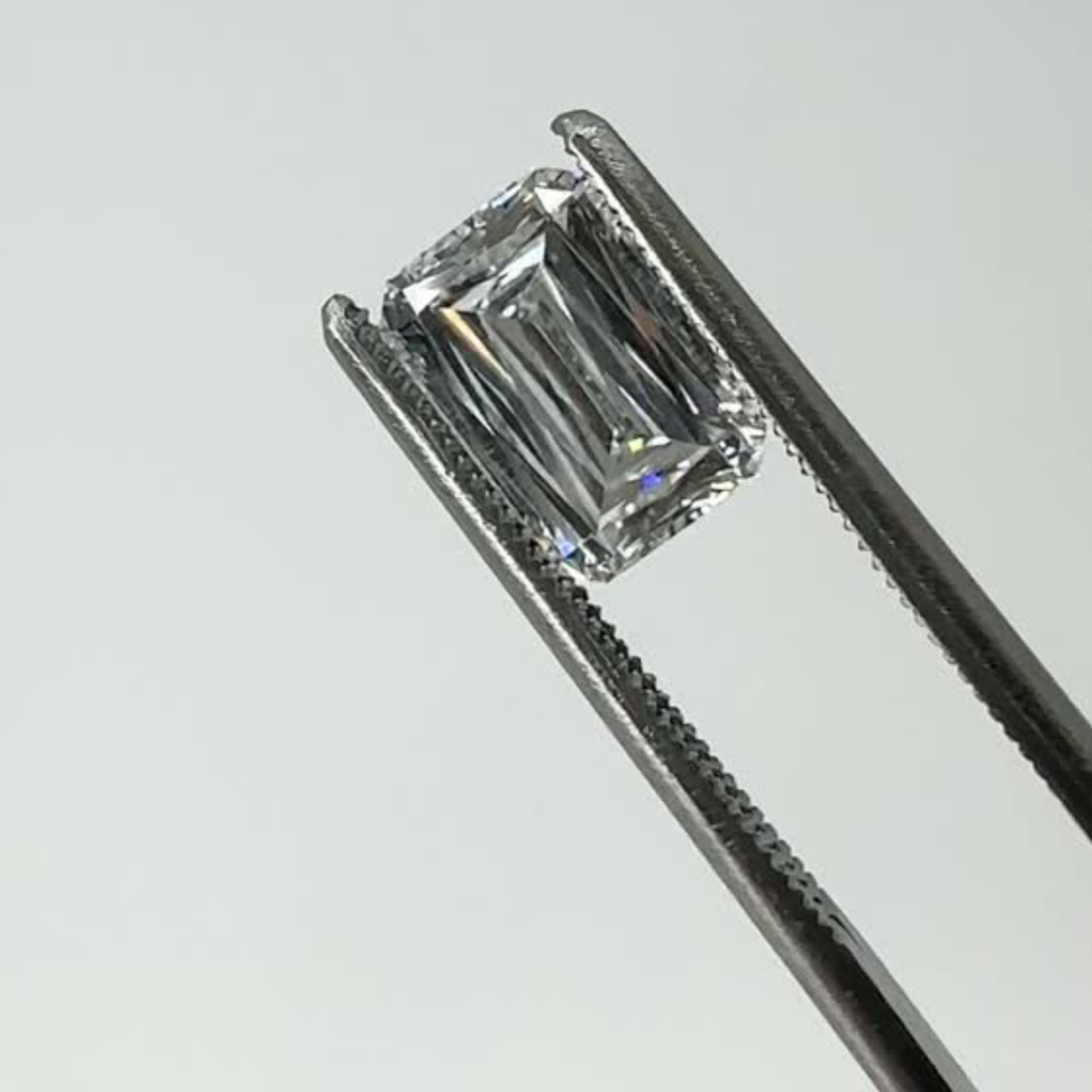 scissor cut lab grown diamond on tweezers