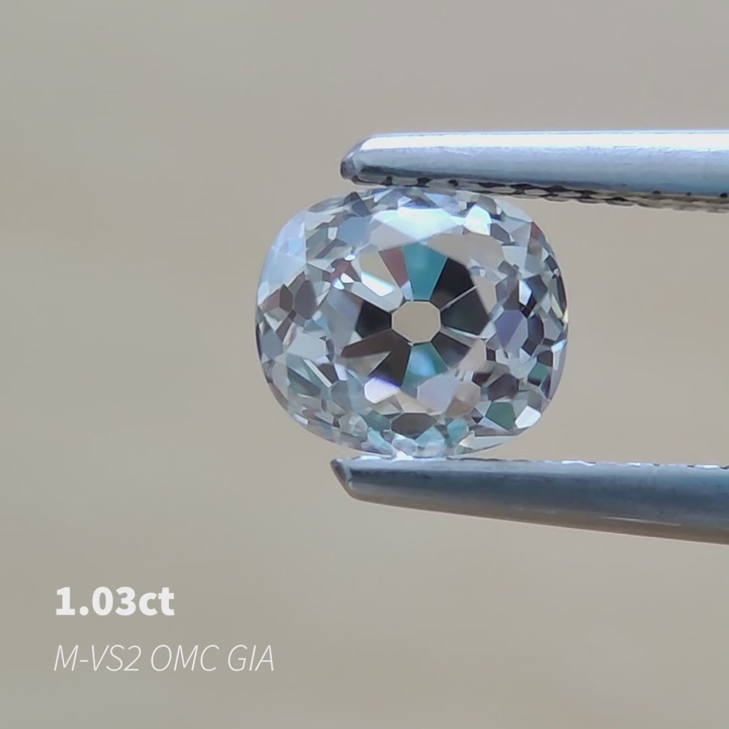 Video of an antique Old Mine Cut natural mined diamond with an open culet and chunky facets. M color, V2 clarity.