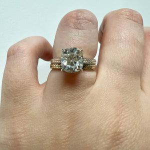 White gold Old Mine cut cathedral engagement ring, with hand wheat engraving inspired by the Art Deco period. Shown on hand stacked with Yara band.