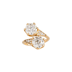 Two-stone toi et moi yellow gold engagement ring set with Old European Cut round moissanite or lab diamonds with one on top of the other. Triangle-shaped sides with lab diamonds. Front view.