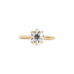 Yellow gold eight-prong solitaire engagement ring set with Old European Cut round moissanite or lab diamond. Knife edge band and integrated basket. Front view.