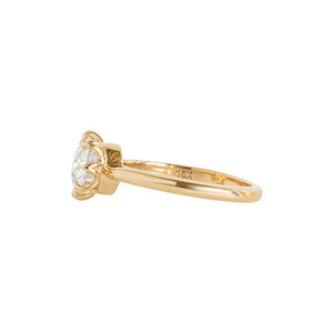 Yellow gold eight-prong solitaire engagement ring set with Old European Cut round moissanite or lab diamond. Knife edge band and integrated basket. Side view.