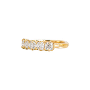 Yellow gold eternity band with five Old Mine Cut moissanite or lab diamond or cushion lab diamonds. Side view.