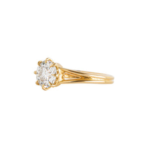 Yellow gold eight-prong solitaire engagement ring with a split shank, set with Old European Cut round moissanite or lab diamond. Knife edge band and integrated basket. Side view.