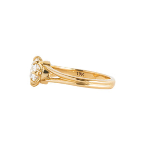 Yellow gold eight-prong solitaire engagement ring with a split shank, set with Old European Cut round moissanite or lab diamond. Knife edge band and integrated basket. Side view.