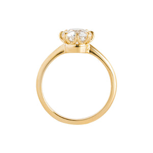 Yellow gold eight-prong solitaire engagement ring set with Old European Cut round moissanite or lab diamond. Knife edge band and integrated basket. Gallery view.