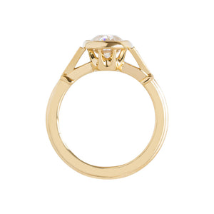 Yellow gold bezel-set antique-inspired oval engagement ring on a white background. Ring has hand-carved milgrain on the bezel and side triangles with accent lab diamonds. Integrated basket, antique fluting on shank. Gallery view.