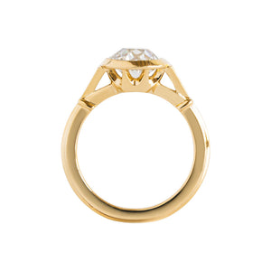 Yellow gold bezel-set antique-inspired Old European Cut round engagement ring on a white background. Ring has hand-carved milgrain on the bezel and side triangles with accent lab diamonds. Integrated basket, antique fluting on shank. Gallery view.