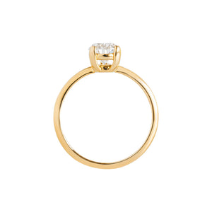 Yellow gold solitaire pear moissanite or lab diamond engagement ring with a V prong and two flat prongs on a white background. Integrated basket. Gallery view.