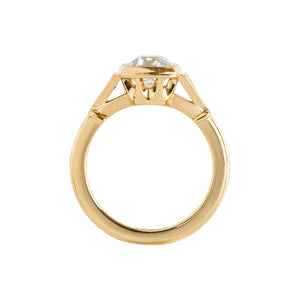 Yellow gold bezel-set antique-inspired Old Mine Cut or antique cushion engagement ring on a white background. Ring has hand-carved milgrain on the bezel and side triangles with accent lab diamonds. Integrated basket, antique fluting on shank. Gallery view.