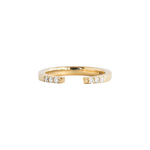 Open wedding band with lab diamond pave accents and a gap in the middle on a white background. 
