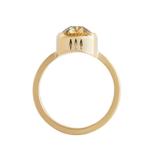 Yellow gold bezel-set engagement ring with hand-carved milgrain and integrated basket, on a white background. Set with a brown Old Mine Cut or antique cushion moissanite or lab diamond. Gallery view.