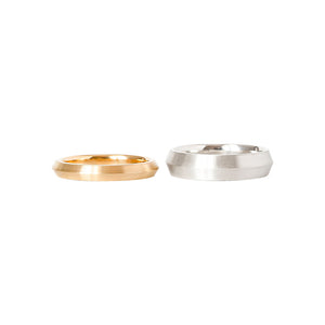 Matte yellow and white gold knife-edge wedding bands in a triangle shape. 3 mm and 5 mm.