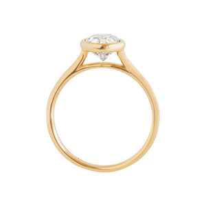 Yellow gold bezel-set oval moissanite or lab diamond solitaire engagement ring on a white background. Floating gallery cathedral. Gallery view.