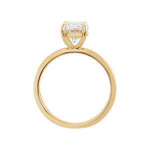 Yellow gold four-prong classic solitaire peg head oval moissanite or lab diamond engagement ring on a white background. Gallery view.