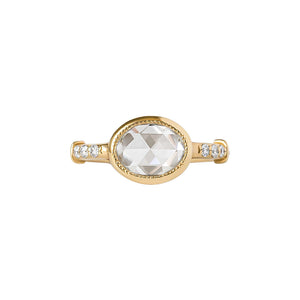 Yellow gold east-west bezel-set engagement ring with lab diamond pave and antique fluting on the band on a white background. Bezel features hand-carved milgrain. Front view.
