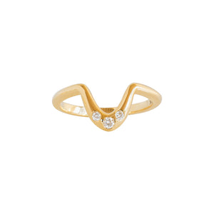 Yellow gold contour wedding band with three flush-set accent stones, in a horseshoe shape on a white background.
