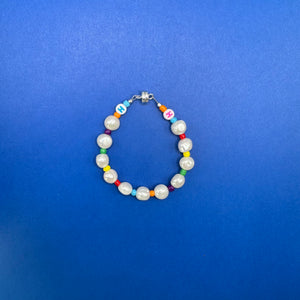 Colorful handmade pearl necklace with brightly colored spacer beads. Magnetic clasp.