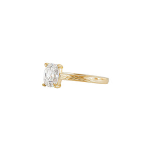 Yellow gold Old Mine cut or cushion brilliant cut cathedral engagement ring, with hand wheat engraving inspired by the Art Deco period. Sideview.
